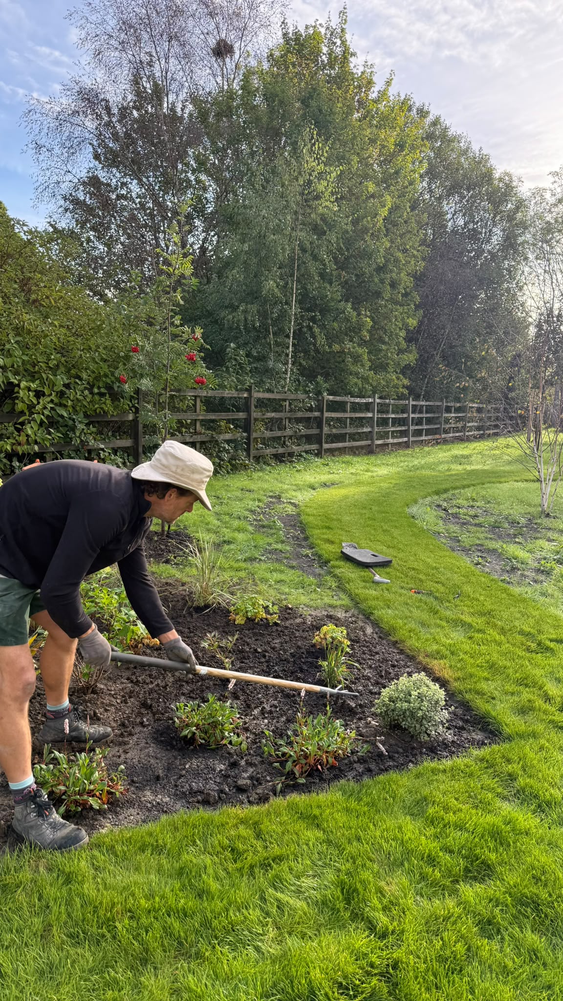 Team tending planting beds on a Garden Innovations aftercare visit