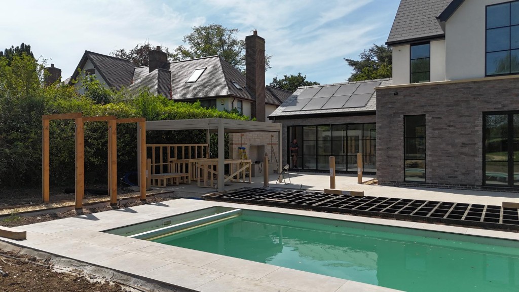Aerial view of pool and pergola progress